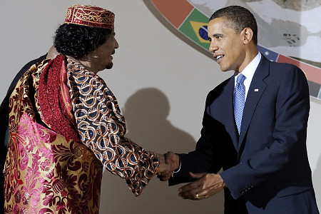 Obama pretending to be friends with former Libyan leader Muammar Gaddafi.
