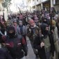 Syrian terrorists march through the streets.