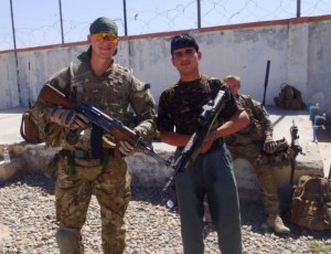 A smiling UK soldier is killed moments after this picture was taken by the Afghan policeman standing next to him.