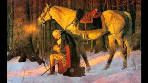 General George Washington kneeling in prayer.