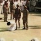 A victim of Sharia law waits for the sword.