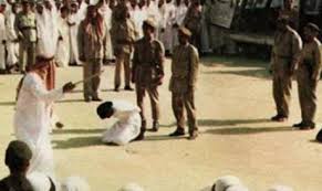 A victim of Sharia law waits for the sword.