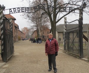 William J. Murray at the gate of Auschwitz which read "Work makes freedom," but the only freedom those who entered ever received was death.