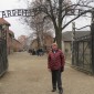 William J. Murray at the gate of Auschwitz which read "Work makes freedom," but the only freedom those who entered ever received was death.