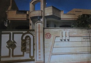 A 74-year-old man who would not give his name because of relatives still in Iraq showed me this picture of his home with the Arabic “nun” letter indicating it was a Christian home. The black writing at right says “Property of the Islamic State.” (Photo: Religious Freedom Coalition)