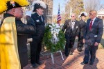William Murray lays wreath at memorial during celebration of religious freedom, as honor guard from the Knights Templar and Knights of Columbus salute.