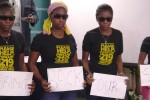 Young Christian women display signs asking for the return of their sisters kidnapped by the Boko Haram