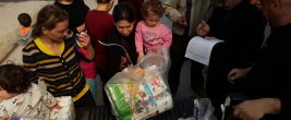 Displaced Iraqi Christian women receive diapers for their infants and toddlers, supplied by the Diapers for Refugees program