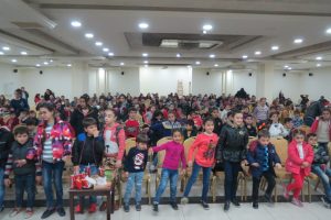 Nearly 300 Iraqi and Syrian Christian refugee children play a game similar to "Simon says" during a Christmas celebration in Amman. Christmas, 2017