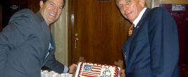 Senator Sam Brownback and William J. Murray hold up "In God We Trust" cake to celebrate passage of National Motto Resolution (2006)