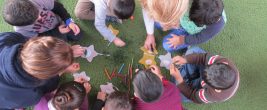 A small group of children make star ornaments as a project during a Christmas for Refugees event at a Nazarene Church in Lebanon. Christmas, 2017