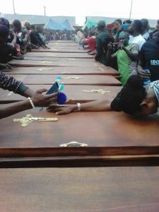 More than 20 coffins lined up for those killed in Benue State by Muslim fighters who violently raided their Christian village.